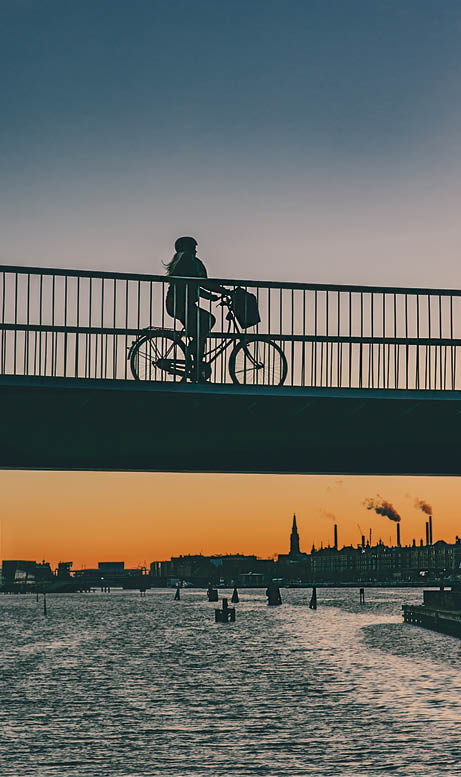 Cykelslangen (The Bicycle Snake) completes the journey over the Bryggebro Bridge, offering Copenhagen's cyclists a fun ride along the harbour and past its tower blocks at first-floor level. As part of Copenhagen's strategy to be one of the best cycling cities in the world, the new cycle bridge will guarantee cyclists improved accessibility and connection to the city. http://www.visitcopenhagen.com/copenhagen/sightseeing/bike-city-copenhagen